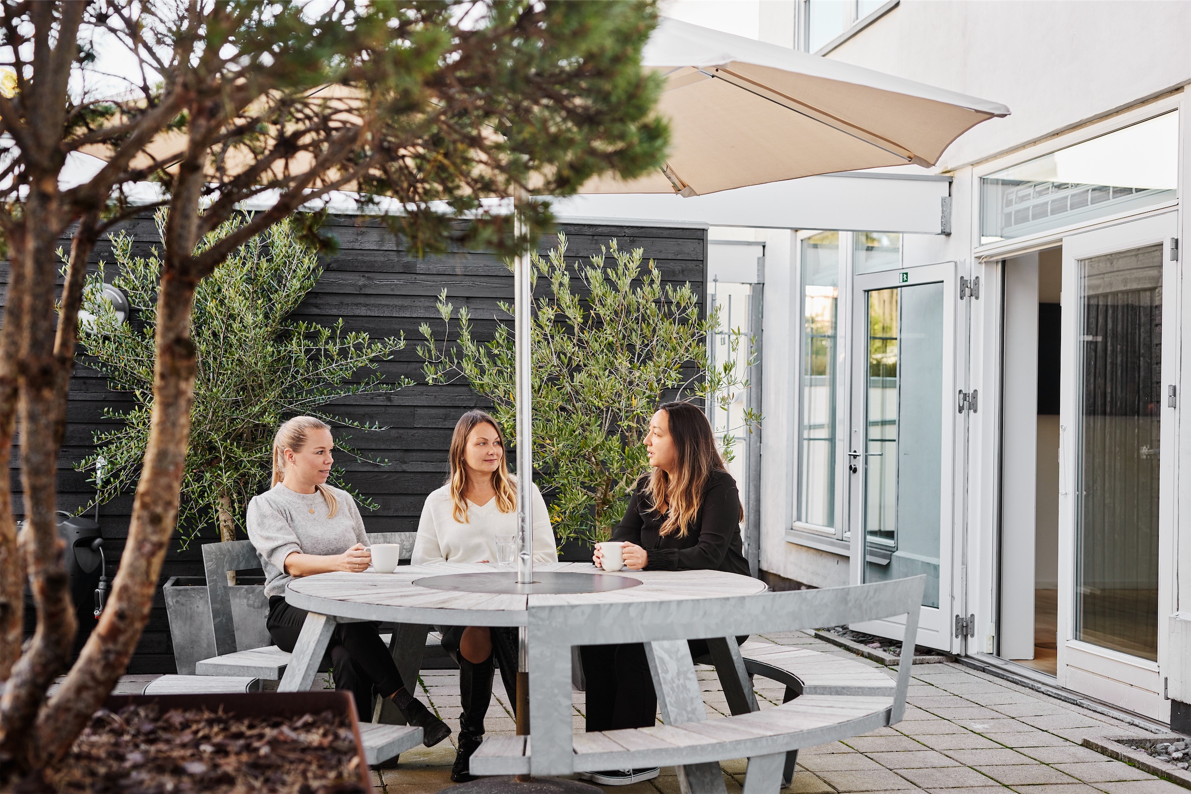 Colleagues having a coffee break at the head quarter of Chr. Olesen in Denmark