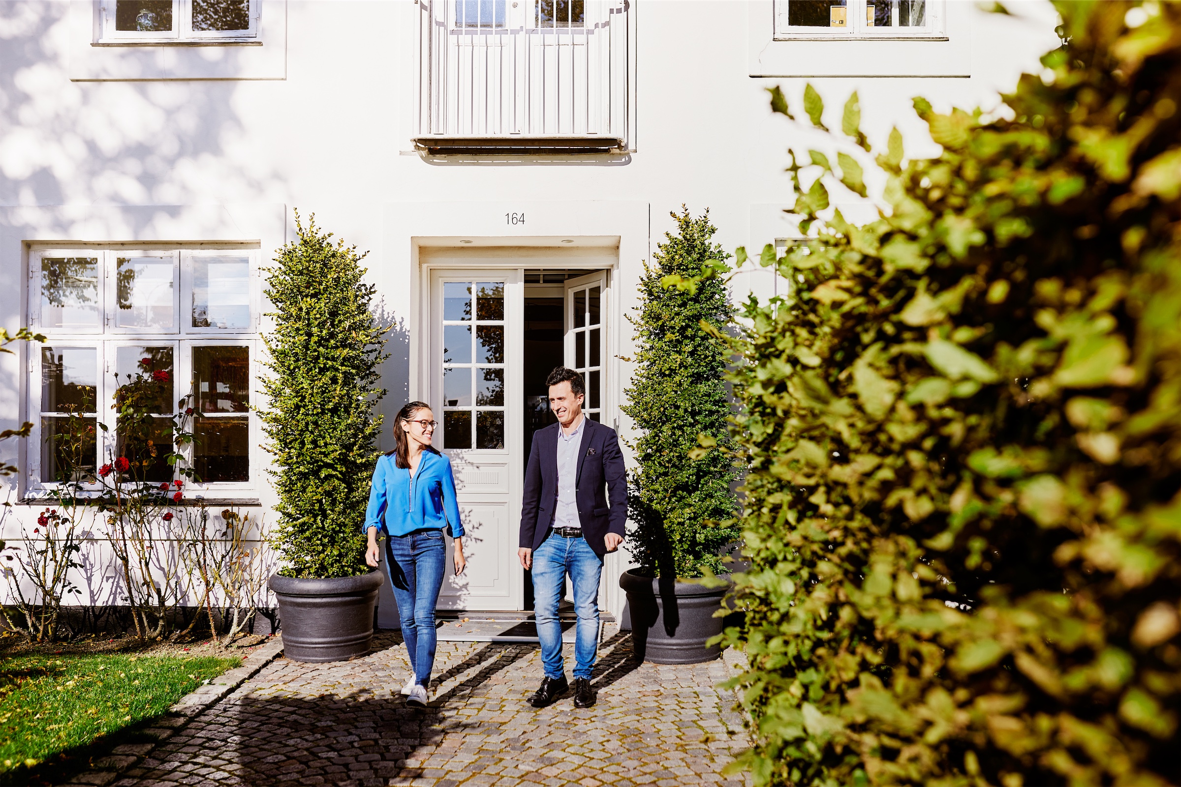 Two employees of Chr. Olesen walking out of the company's head quarter building
